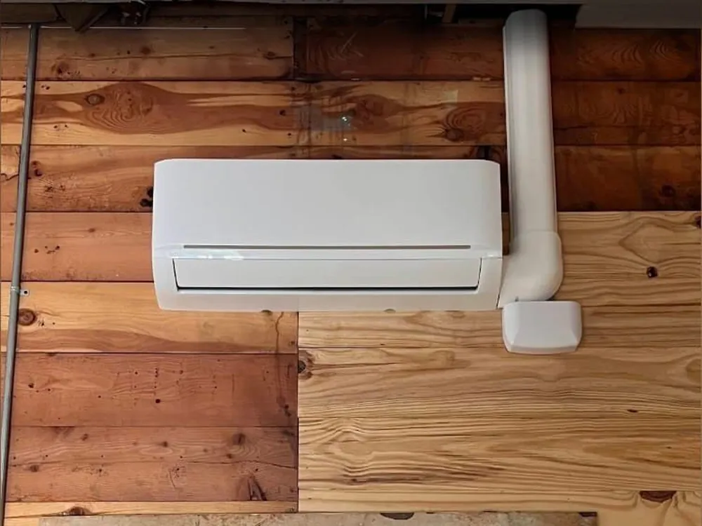 Next Phase technician installing a ductless mini split