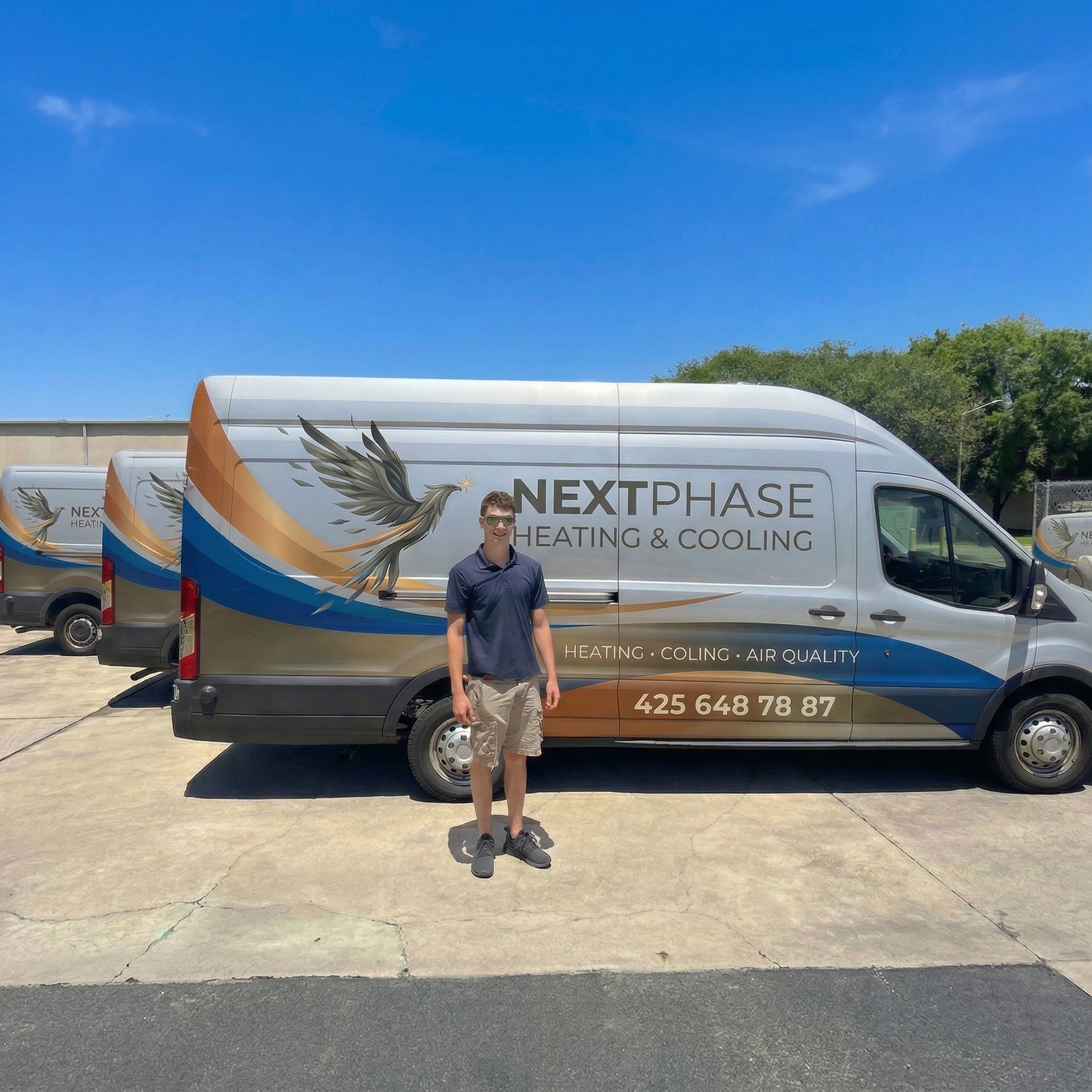 Next Phase Heating, Air Conditioning & Electric team with service vans