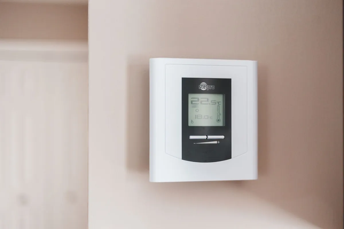 Basic programmable thermostat on a wall