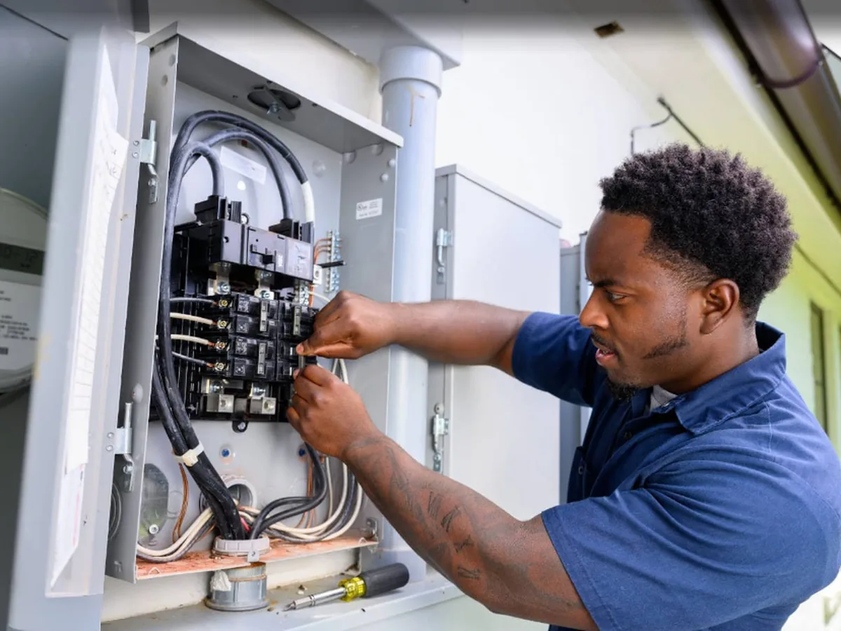 Technician replacing an electrical motor component